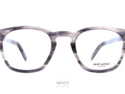 Lunettes Saint Laurent SL 30 SLIM grises. La série SLIM de chez Saint Laurent est une façon de faire exclusive de chez eux. Visuellement la monture a l'air la même mais, elle est beaucoup plus fine. L'épaisseur a été réduite au maximum, afin d'offrir une paire de lunettes légère tout en gardant de la présence, du style et de la personnalité.   