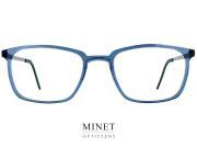 Lindberg Acetanium 1231 Lunettes optiques pour hommes. Montures fines et rectangulaires. La face en acétate est bleu transparente. Et les branches sont en titane. Le tout donnant un aspect classico moderne et faisant une monture très légère et confortable. 