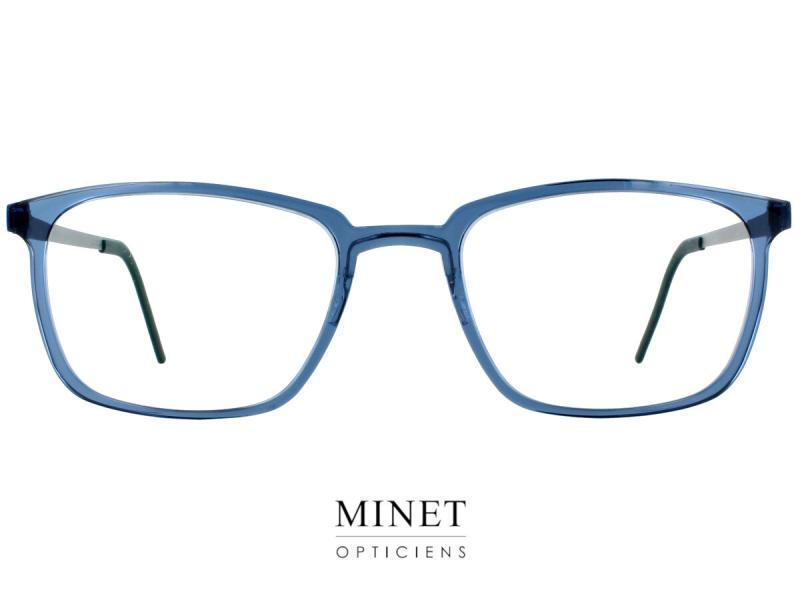 Lindberg Acetanium 1231 Lunettes optiques pour hommes. Montures fines et rectangulaires. La face en acétate est bleu transparente. Et les branches sont en titane. Le tout donnant un aspect classico moderne et faisant une monture très légère et confortable. 